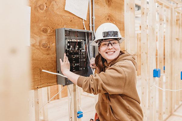 An electrical program student works in class