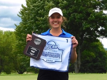 Ellia Soydara with her medalist plaque after winning the 2024 championship.