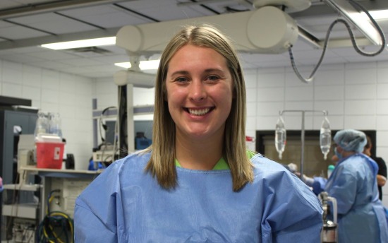 Sierra Parkinson, Surgical Technology student, in a blue hospital gown