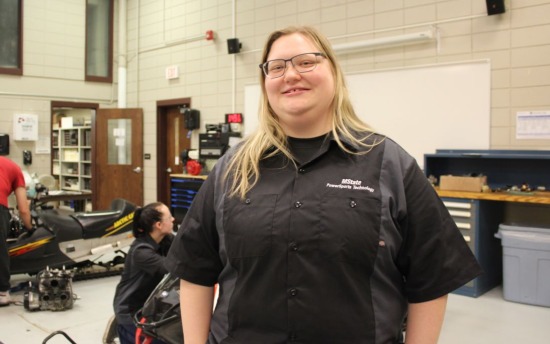 Tess Maser, PowerSports student, in uniform in class