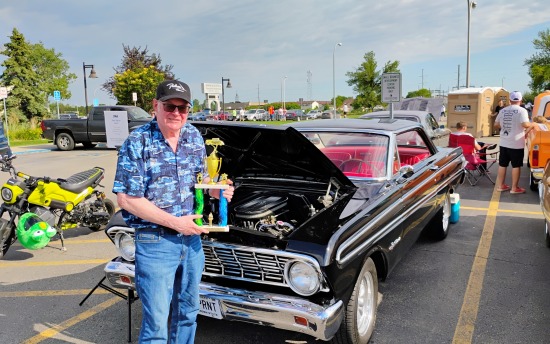 Robert Berry, the first winner of the M State SOAT Auto Heritage Award, with his winning 1964 Ford Falcon Sprint at Moorhead Cruise Night in May.