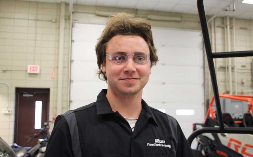 Anthony Carnivale, PowerSports student, in uniform in class