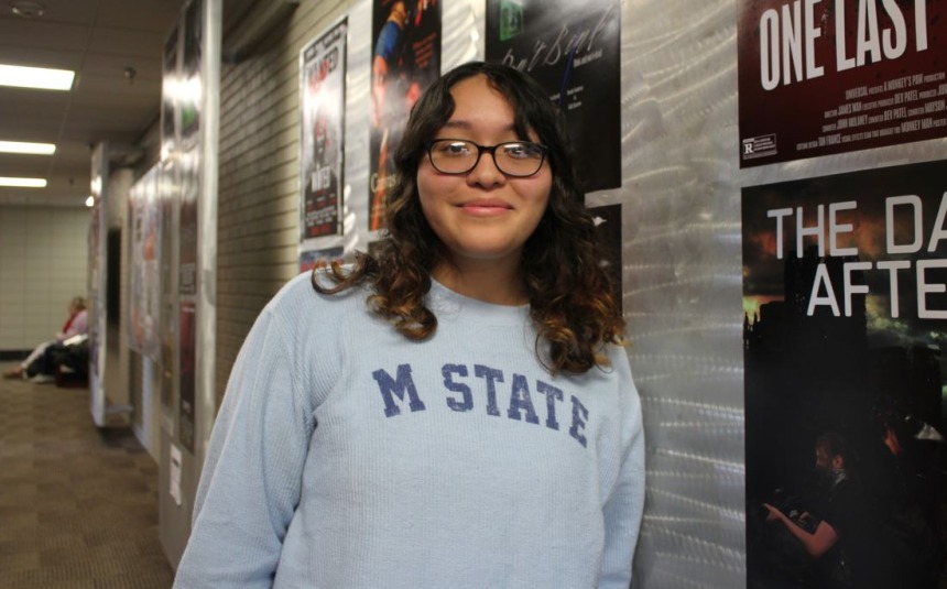 Jocelyn Galdamez, Graphic Design student, in M State sweatshirt at the M State-Moorhead campus