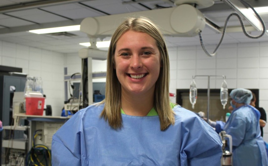 Sierra Parkinson, Surgical Technology student, in a blue hospital gown