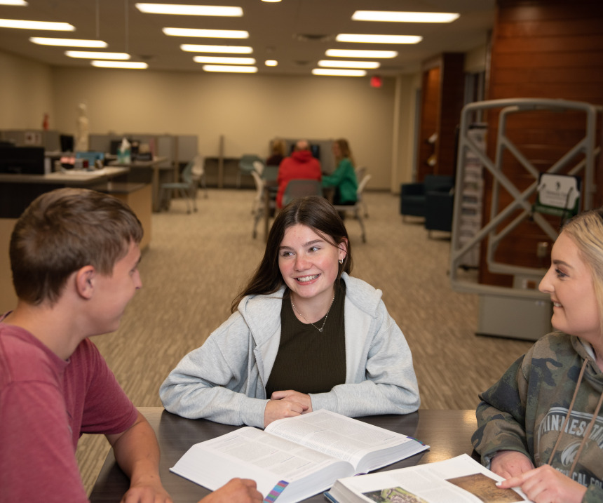 Students studying at a table at M State in Wadena