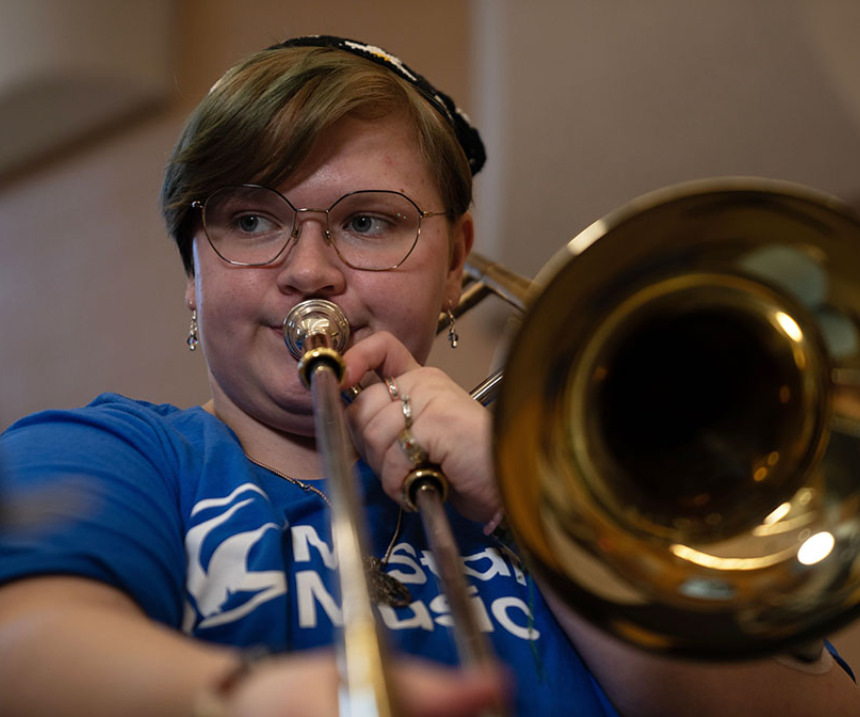 A student plays trombone